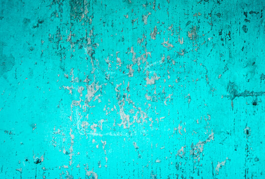 Cracked painted blue teal background with texture and grunge finish