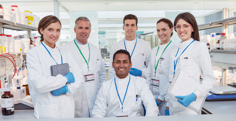 Scientists smiling in laboratory