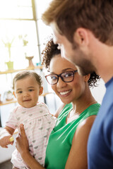 Portrait of parents with baby daughter