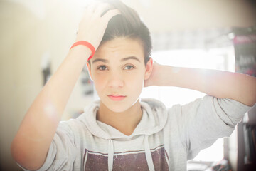 Portrait of teenage boy with hand in hair © Tom Merton/KOTO