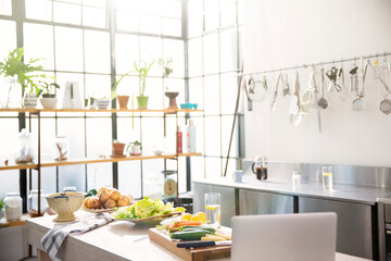 Interior of domestic kitchen with vegetables on kitchen counter