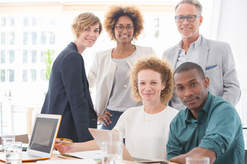 Obraz premium Portrait of office team smiling in conference room