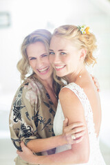 Portrait of bride and matron of honor at wedding reception