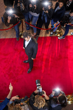 Celebrity Being Photographed By Paparazzi Photographers At Red Carpet Event