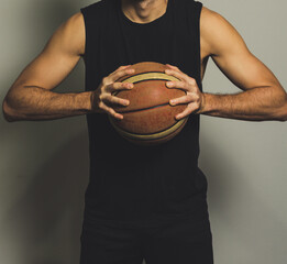 young man holding a basketball