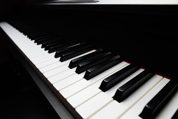 black and white piano keys closeup, standard 88 key, dark background