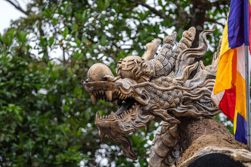 Colorful dragon sculpture at the entrance to a Buddhist temple in the city of Danang, Vietnam