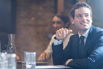 Smiling businessman in conference room meeting