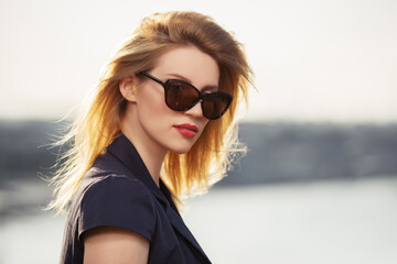 Young fashion woman in sunglasses outdoor