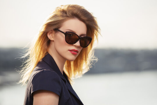 Young fashion woman in sunglasses outdoor