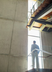 Pensive man at window on platform