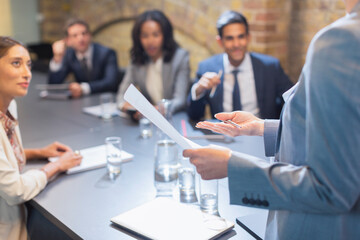 Businesswoman leading meeting in conference room