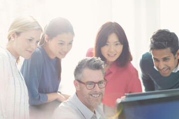 Fototapeta premium Business people working at computer in sunny office