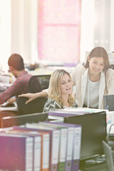 Fashion designers working at desk in office