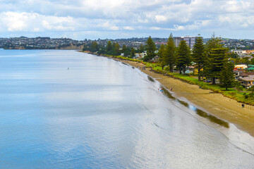 Panoramic View of Orewa Beach, Auckland New Zealand; During High Tide with Calm Water