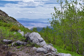 Rocky Mountain Wasatch Front peaks, panorama landscape view from Butterfield Canyon Oquirrh range toward Provo, Tooele Utah Lake by Rio Tinto Bingham Copper Mine, Great Salt Lake Valley in spring. Uta