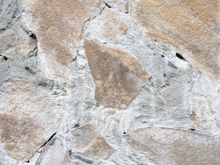 texture of the wall interspersed with natural stone, cement bounded
