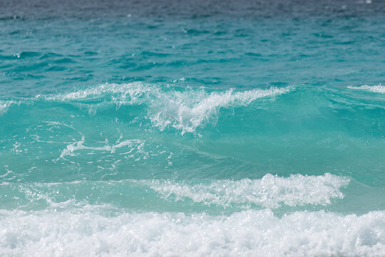 Turquoise blue wave at the whitest beach in the world.