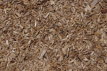 High angle full frame close-up view directly from above of a part of an area with chipped wood as a ground cover