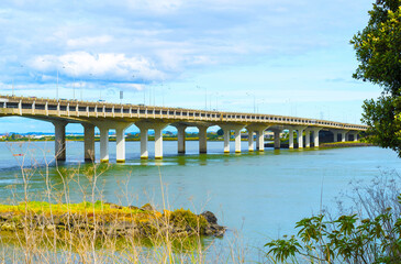 Landscape View to Mangere bridge over the Manukau Harbour, Motorway Bridge in South-Western Auckland New Zealand