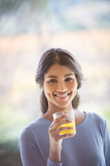 Portrait smiling woman drinking orange juice