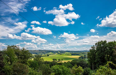 German rural landscape near Velbert Langenberg with fields and hills and a Farm in Background