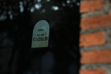 We are closed sign on glass door at shop or restuarant