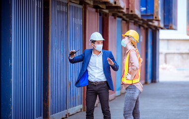 A Manager and dock worker under discussion about dock container shipping warehouse document, they...