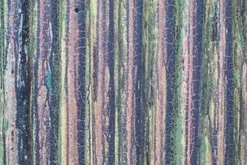 Old weathered corrugated sheet /panel with peeled paint. Background texture of rusty painted corrugated iron cladding