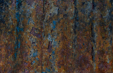 Old weathered corrugated sheet /panel with peeled paint. Background texture of rusty painted corrugated iron cladding