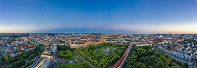 Beautiful aerial view over the bavarian metropole city Munich with the alps mouintains in the background. Total panoramic view over the authentic cityscape.