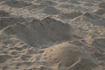 Closeup of a symbolic grave in the Copacabana beach sand as protest against government handling of COVID-19 Coronavirus outbreak