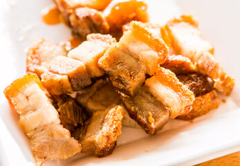 crispy pork with sauce in plate, Thai street food