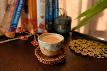 インドのチャイでリラックス。Relax time with Indian Chai(Tea) and books on a old wooden table