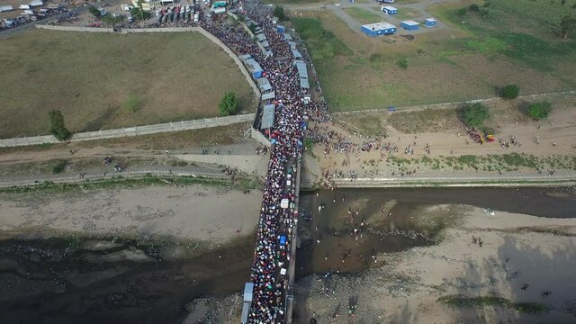 Dajabon bridge seen from above with crowd crossing border. Dominican Republic