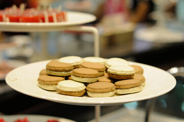 Vanilla and Coffee Macarons on a Large Plate