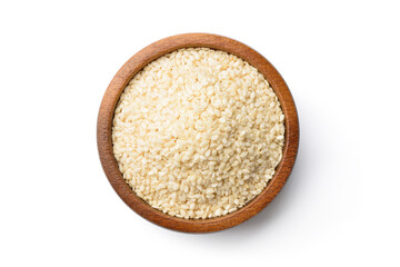 Top view (flat lay) of white sesame seeds in wooden bowl isolated on white background.  clipping...