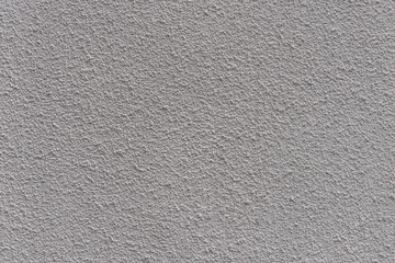 Wall is painted with white plaster with fine texture.