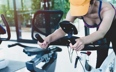 young woman doing fitness exercise in the gym