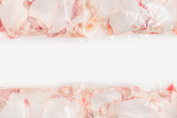 Packages of fresh raw chicken meat with white space line in center. Studio shot. Healthy nutrition mock up.