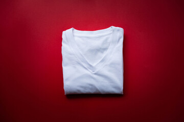 White cotton shirt putted on red seat