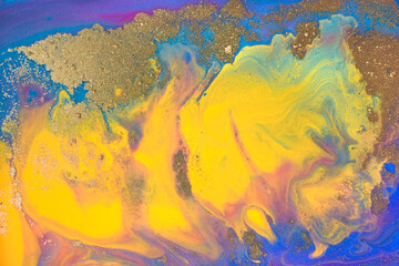 Blue and yellow marble pattern with golden glitter. Artwork abstract texture.