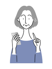 スマートフォンを操作するシニア女性