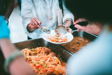 Concept of feeding : Sharing food with people in poor communities