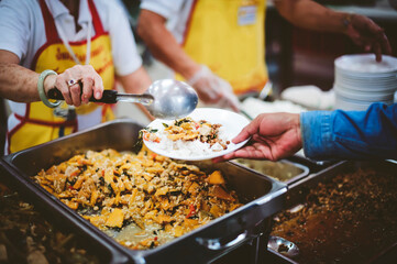 Concept of feeding : Sharing food with people in poor communities