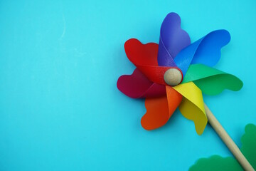 colorful pinwheel with space copy isolated on blue background