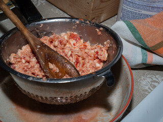 Homemade dinner based on frying. The preparation of a panzerotto a typical southern Italian product stuffed with tomato and mozzarella and deep fried.
