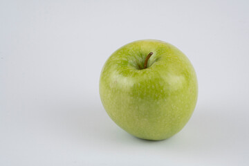 Red and green apple, half apple, bitten apple on a white background, seeds