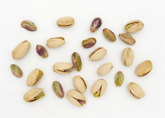 Pistachio nuts on white background. Top view. Top view.