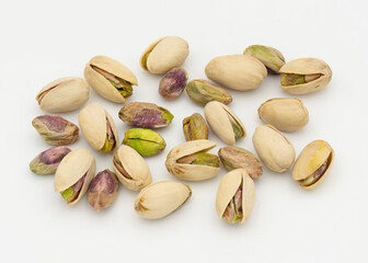 Pistachio nuts on white background. Top view.